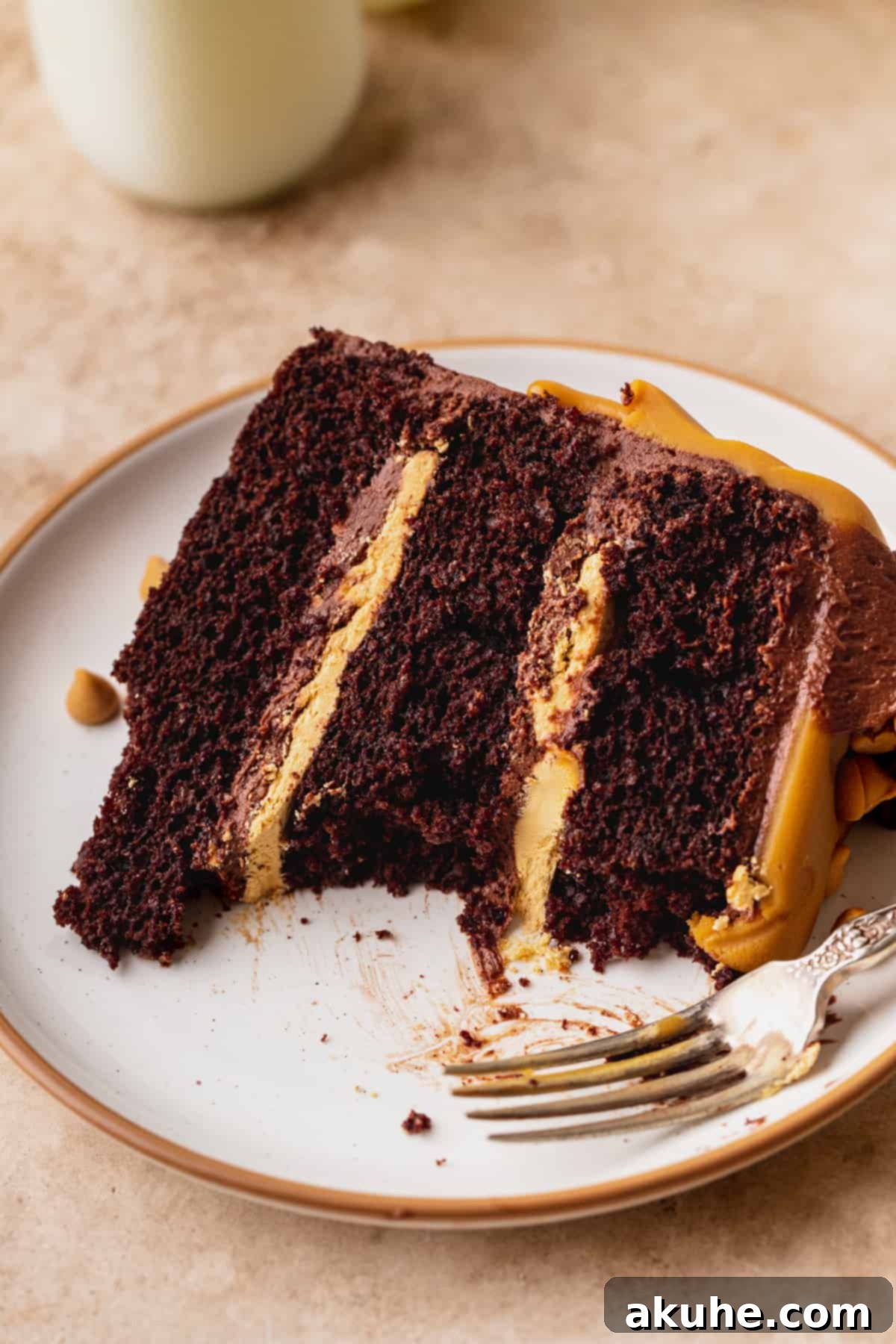 A delicious slice of Chocolate Butterscotch Cake, showcasing the rich layers and tempting flavor, with a few bites happily missing.