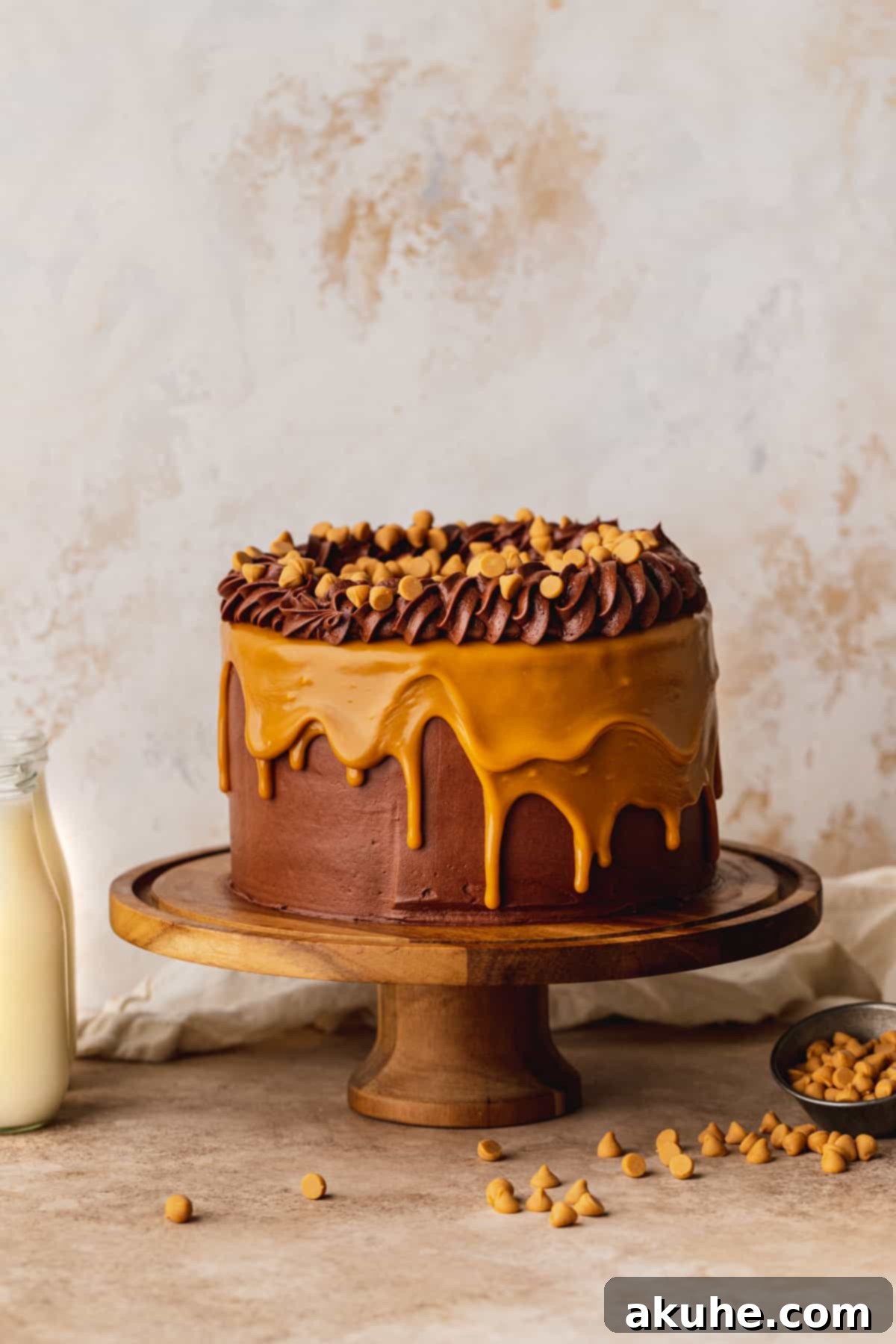 The full Chocolate Butterscotch Cake elegantly displayed on a cake stand, ready to be served.