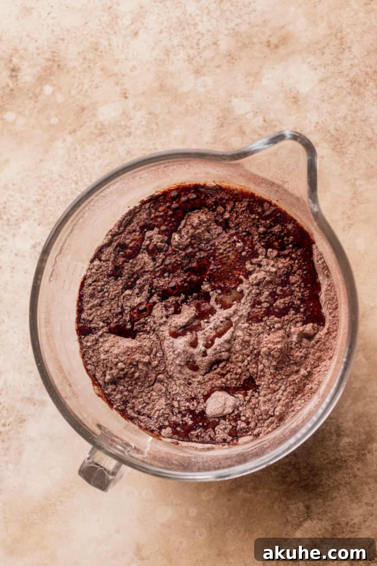 Dry ingredients patiently awaiting the wet components in a large mixing bowl.
