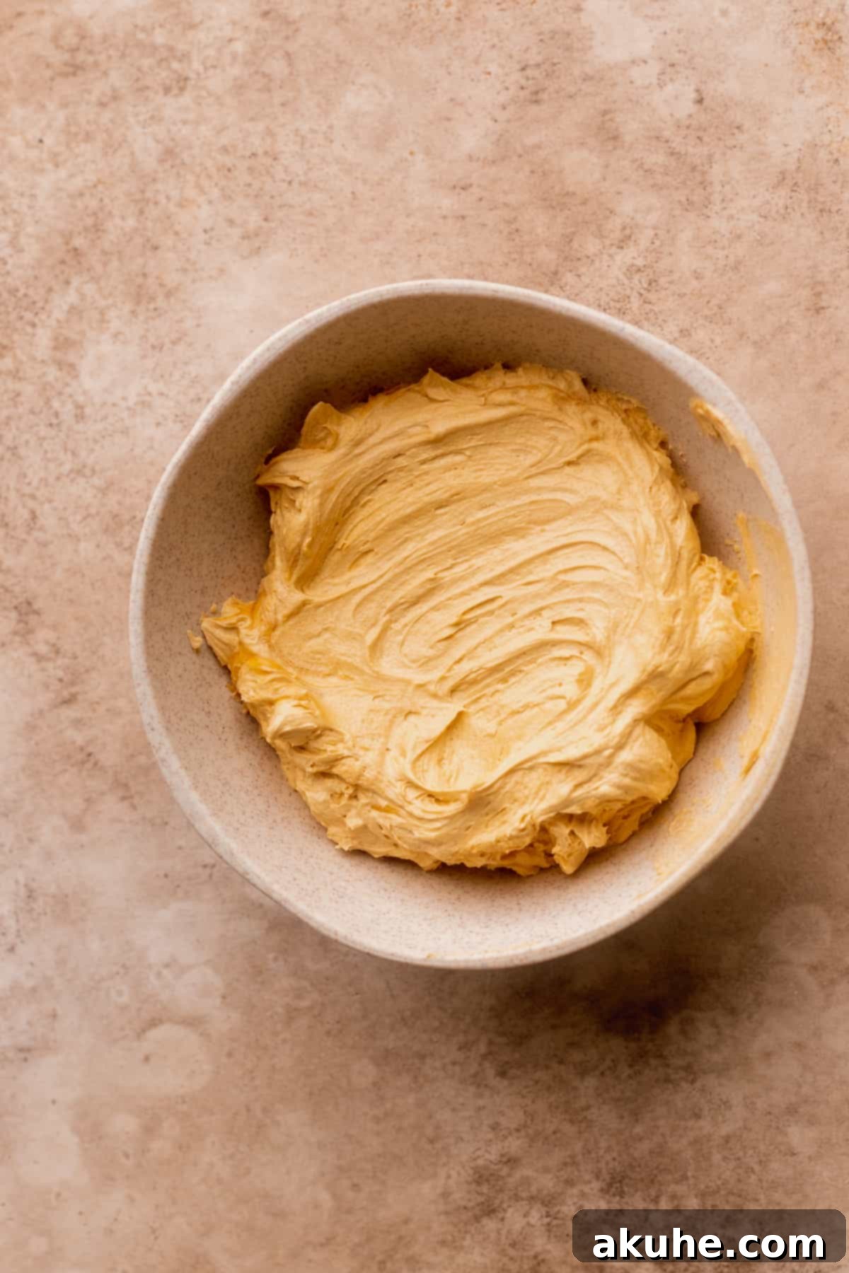 Luxuriously whipped butterscotch ganache showcased in a bowl, light and fluffy.