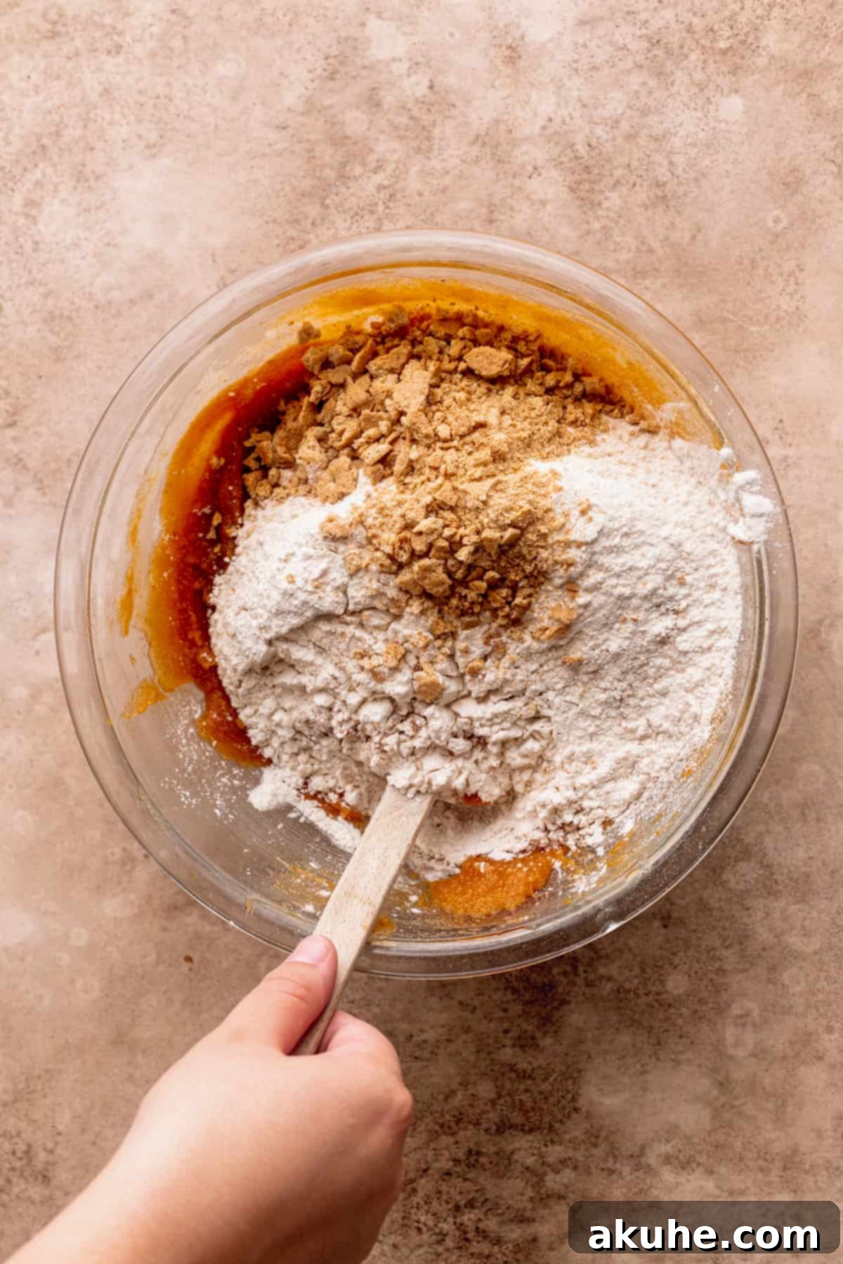 Pumpkin S'mores Cookies 5 Dry ingredients being added to the wet mixture.