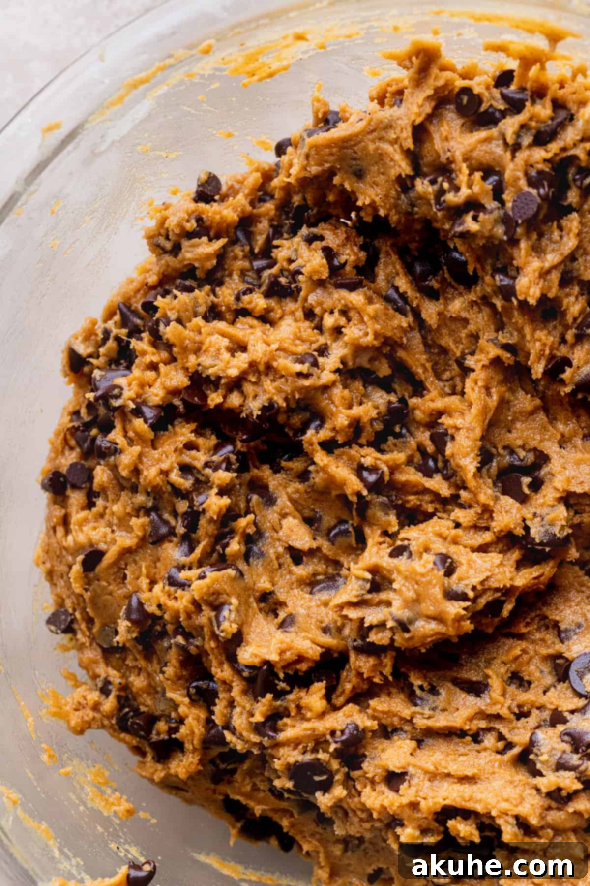 Pumpkin S'mores Cookies 6 Pumpkin cookie batter in a glass bowl, ready for scooping.