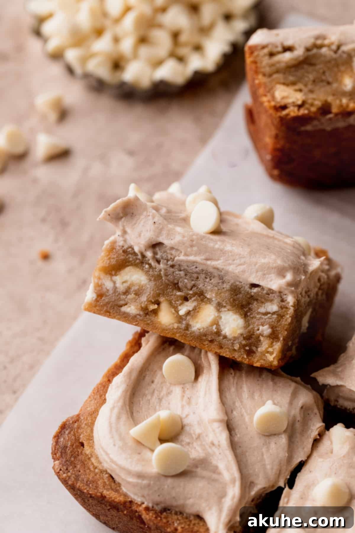 Side view of a perfectly frosted White Chocolate Cinnamon Blondie.