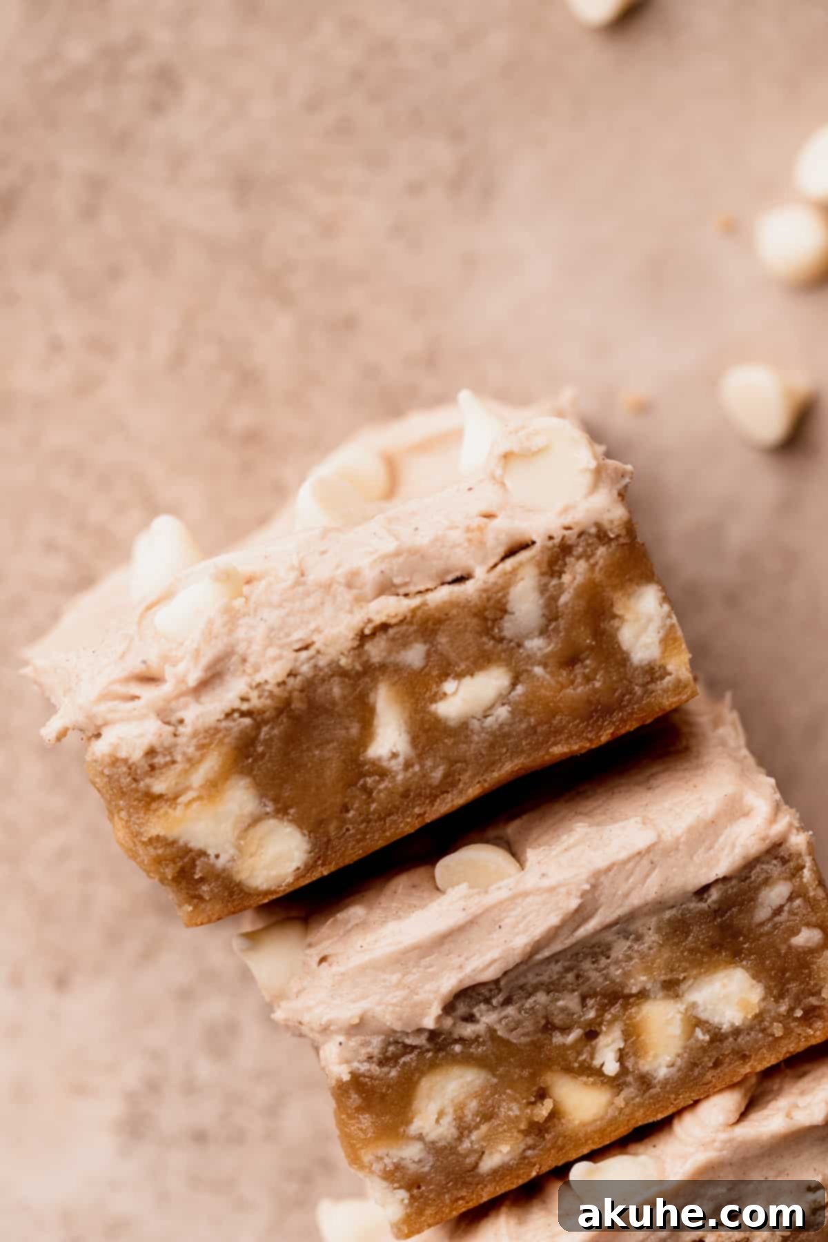 Top-down view of freshly baked White Chocolate Cinnamon Blondies arranged on a serving plate.