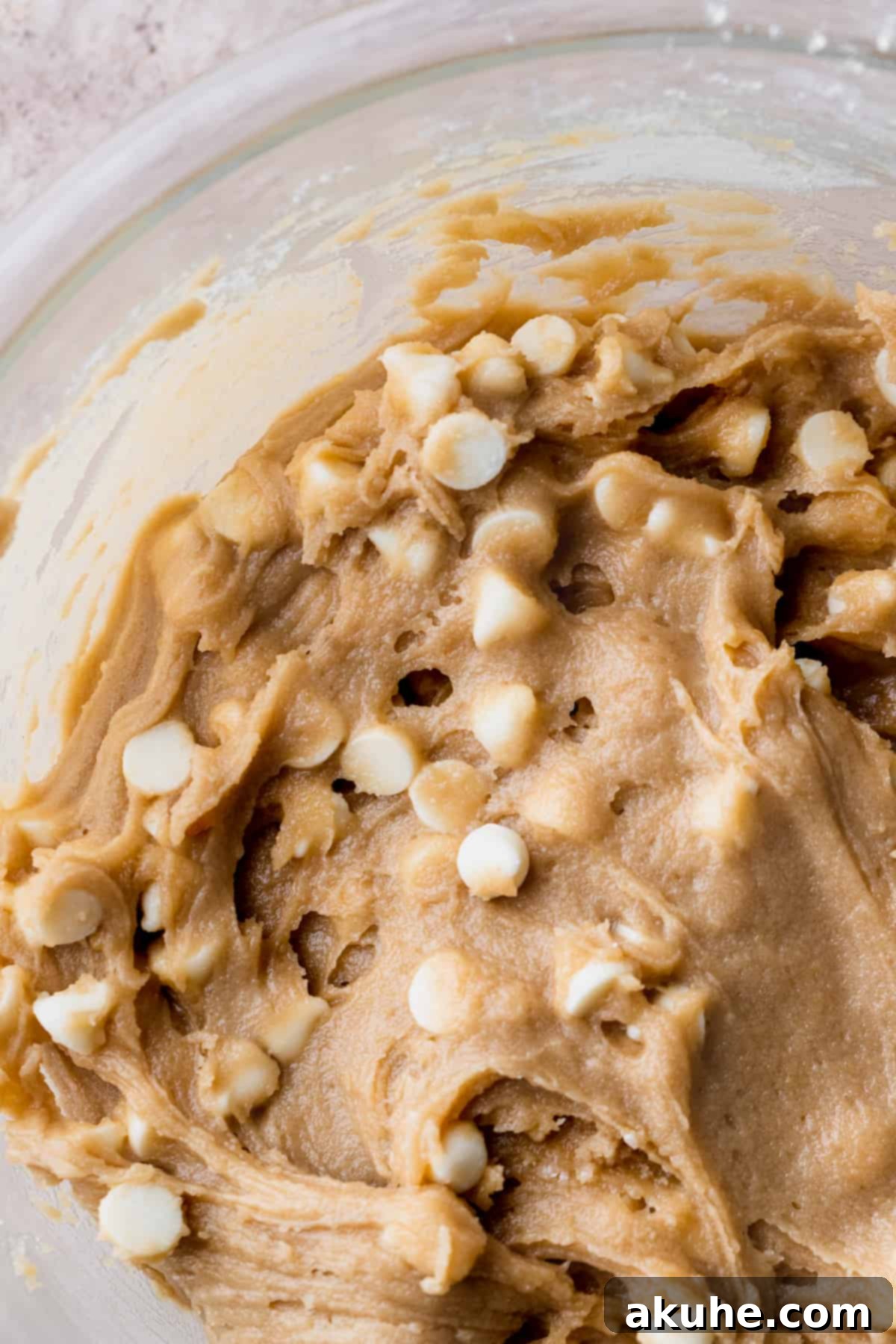 Smooth blondie batter in a glass bowl, ready for baking.
