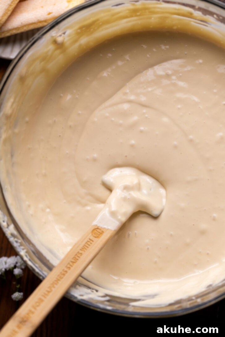 Mascarpone Mocha Cheesecake 5 Smooth, creamy espresso cheesecake batter in a mixing bowl, ready to be poured.