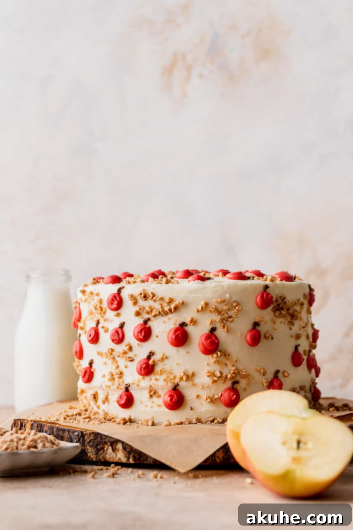 Irresistible Apple Toffee Cake 2 A stunning Apple Toffee Layered Cake, beautifully presented on a rustic wooden board, ready to be sliced.