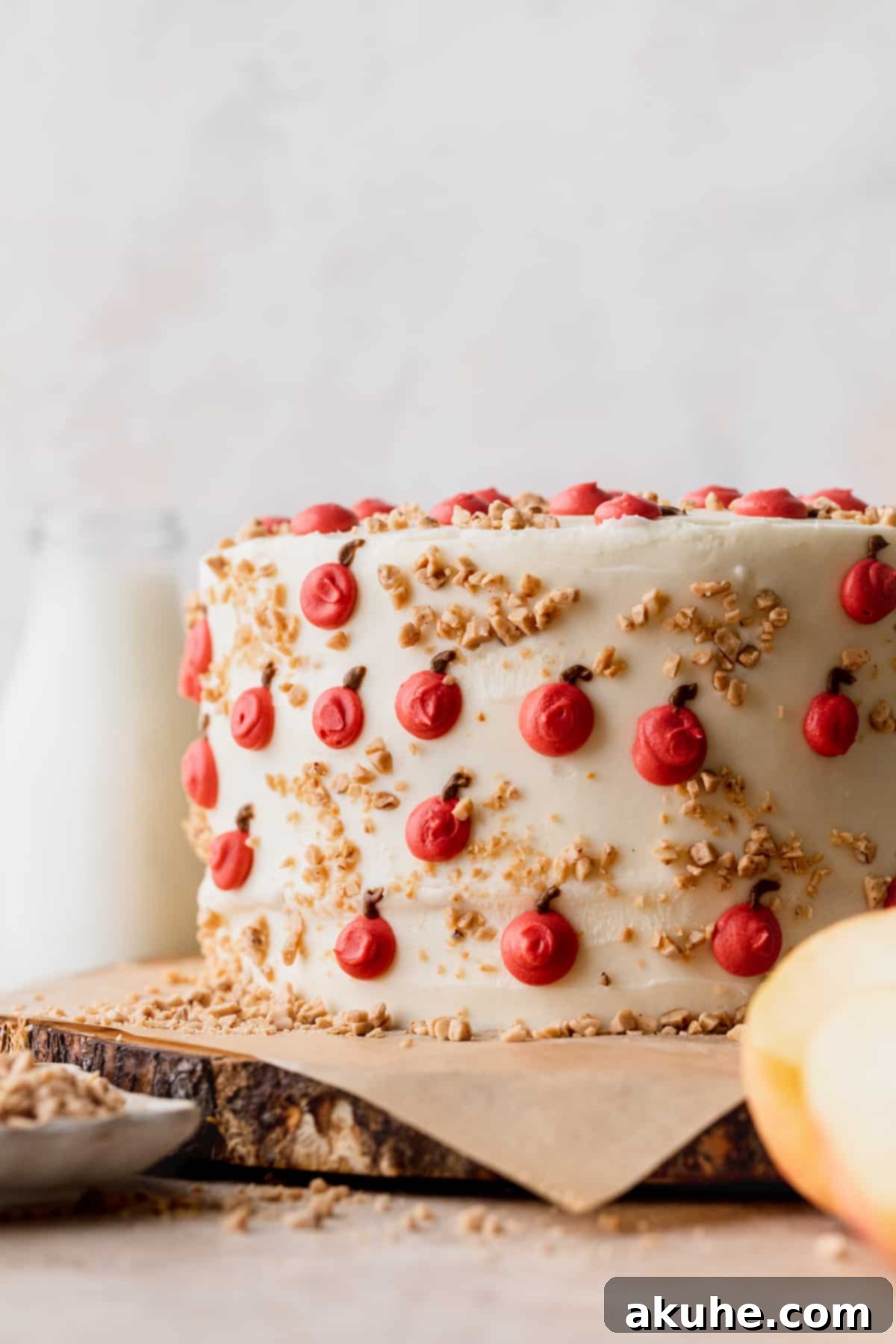 Irresistible Apple Toffee Cake 11 A close-up of the decorated Apple Toffee Layered Cake, showing piped apples and toffee bits.