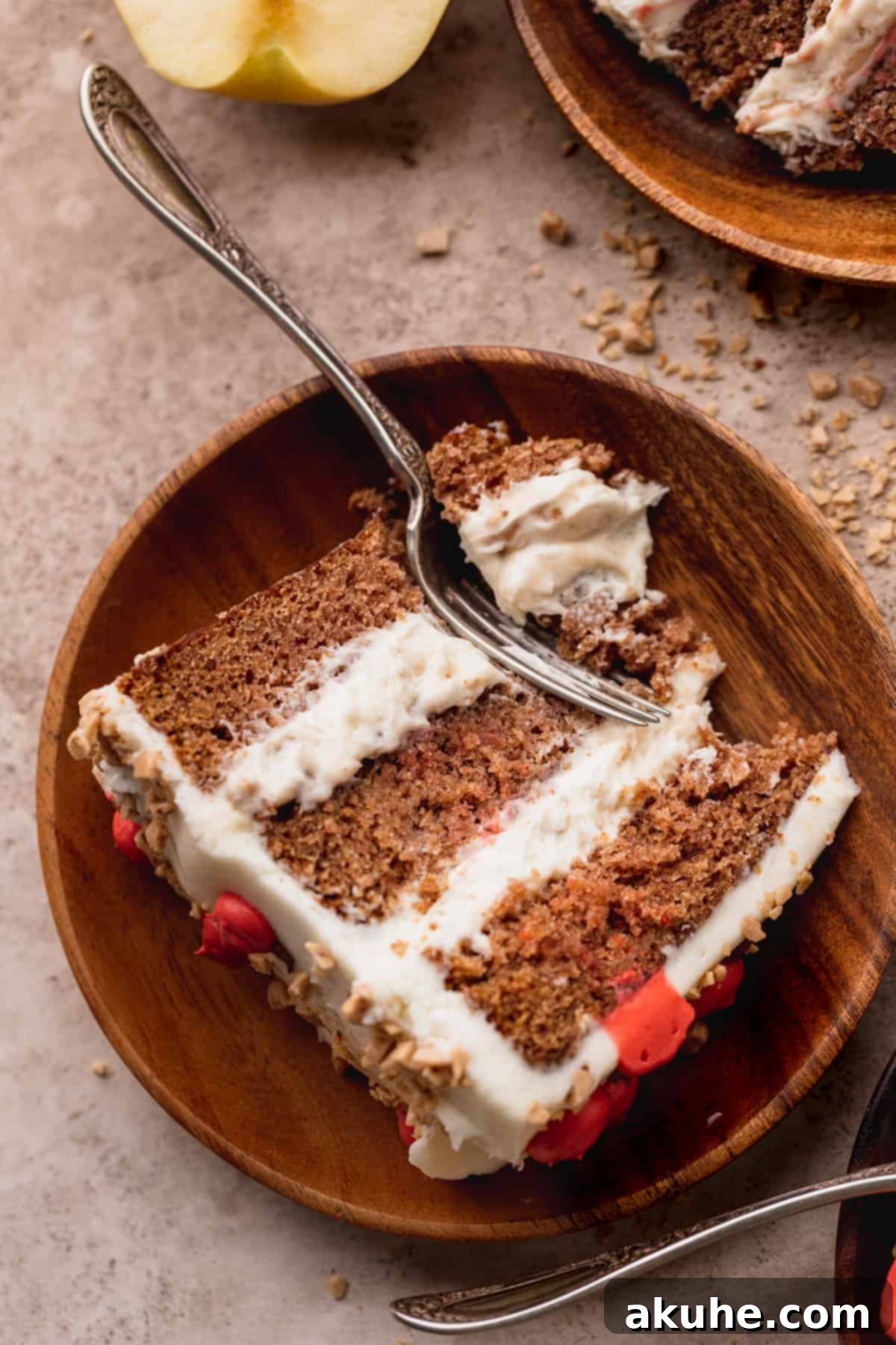 Irresistible Apple Toffee Cake 3 A close-up top view of a perfectly sliced Apple Toffee Layered Cake, revealing its moist layers and creamy filling.