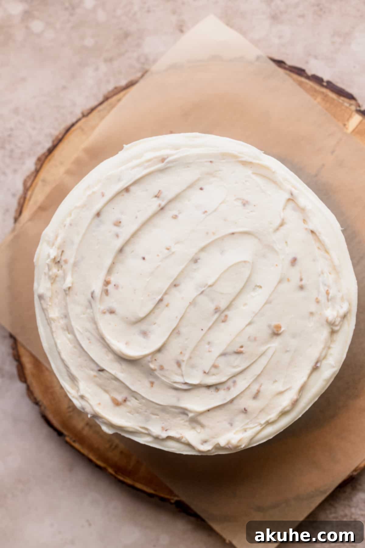 Irresistible Apple Toffee Cake 10 Toffee whipped cream cheese filling spread evenly over a cake layer within a frosting dam.