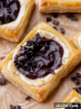 Indulgent Chocolate Cream Cheese Danish 11 Chocolate cream cheese danish on a parchment paper.