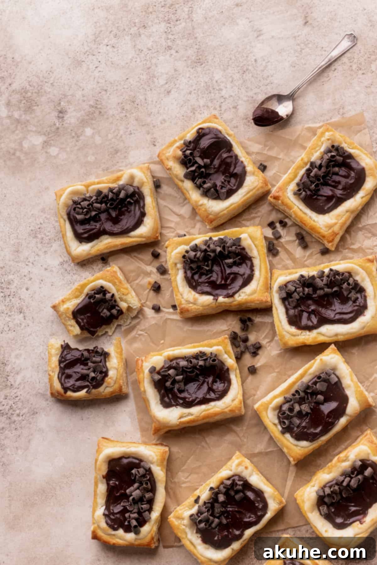 Indulgent Chocolate Cream Cheese Danish 4 Spread of danishes on parchment paper.