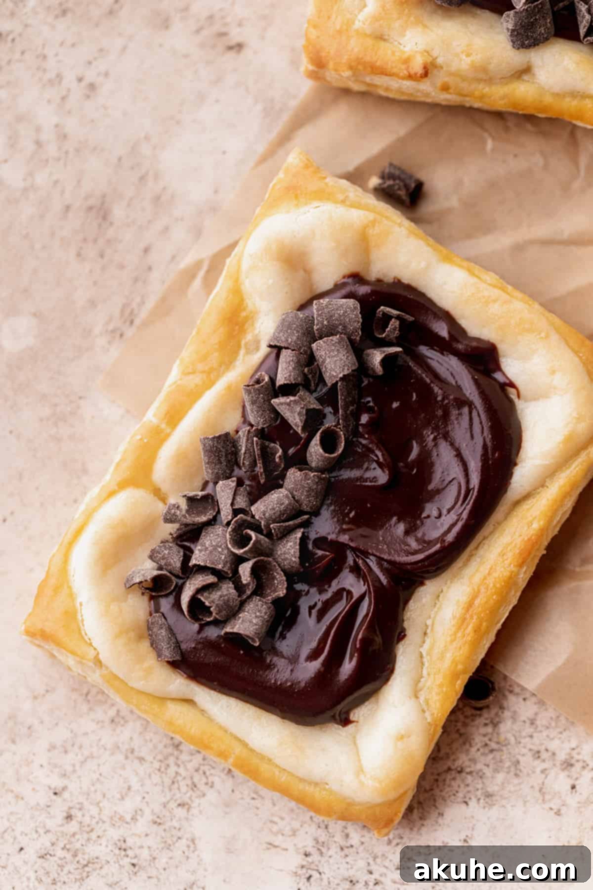 Indulgent Chocolate Cream Cheese Danish 10 Chocolate cream cheese danish with chocolate curls on top.