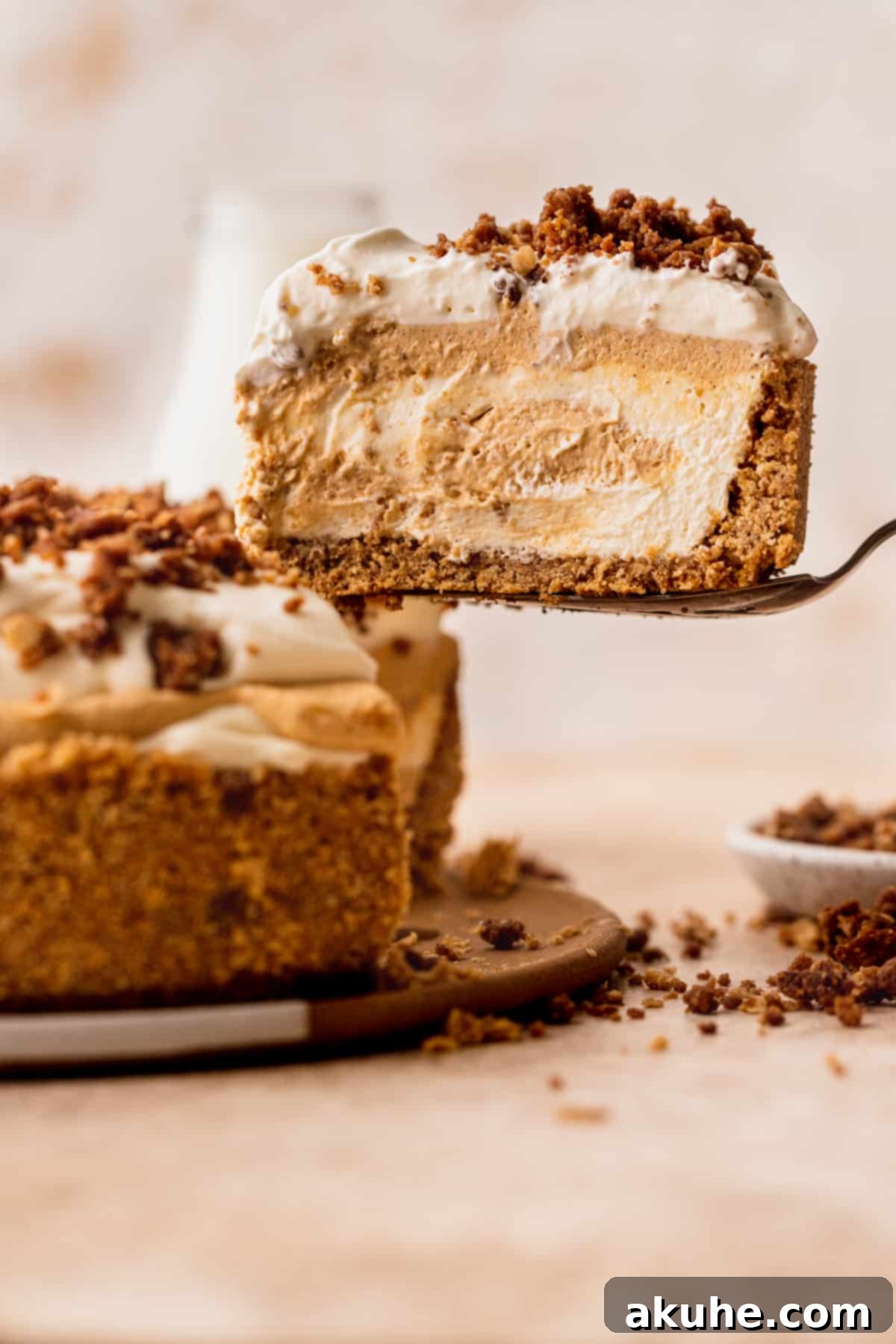 Marbled No Bake Pumpkin Cheesecake 2 Swirled no bake pumpkin cheesecake taking a slice out.