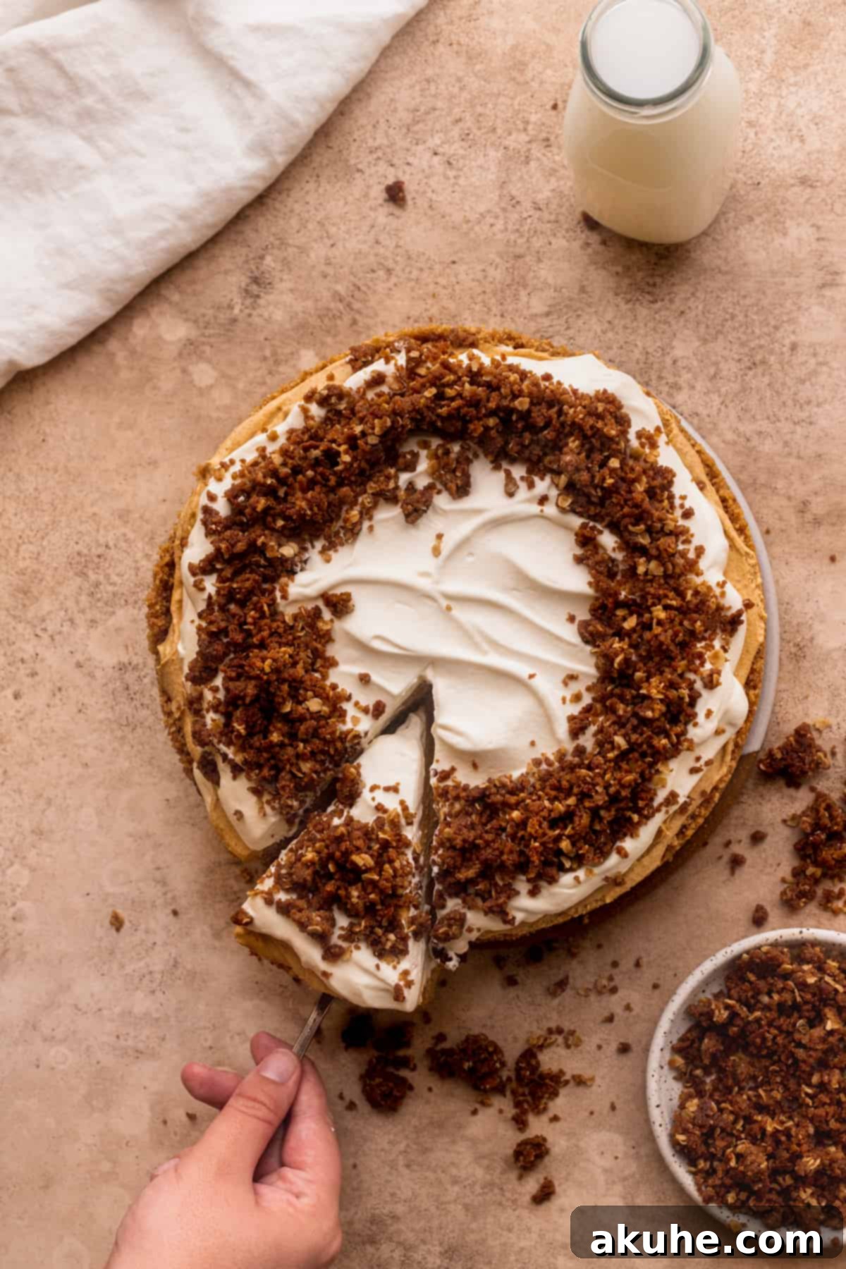 Marbled No Bake Pumpkin Cheesecake 3 Swirled no bake pumpkin cheesecake with a slice taken out.