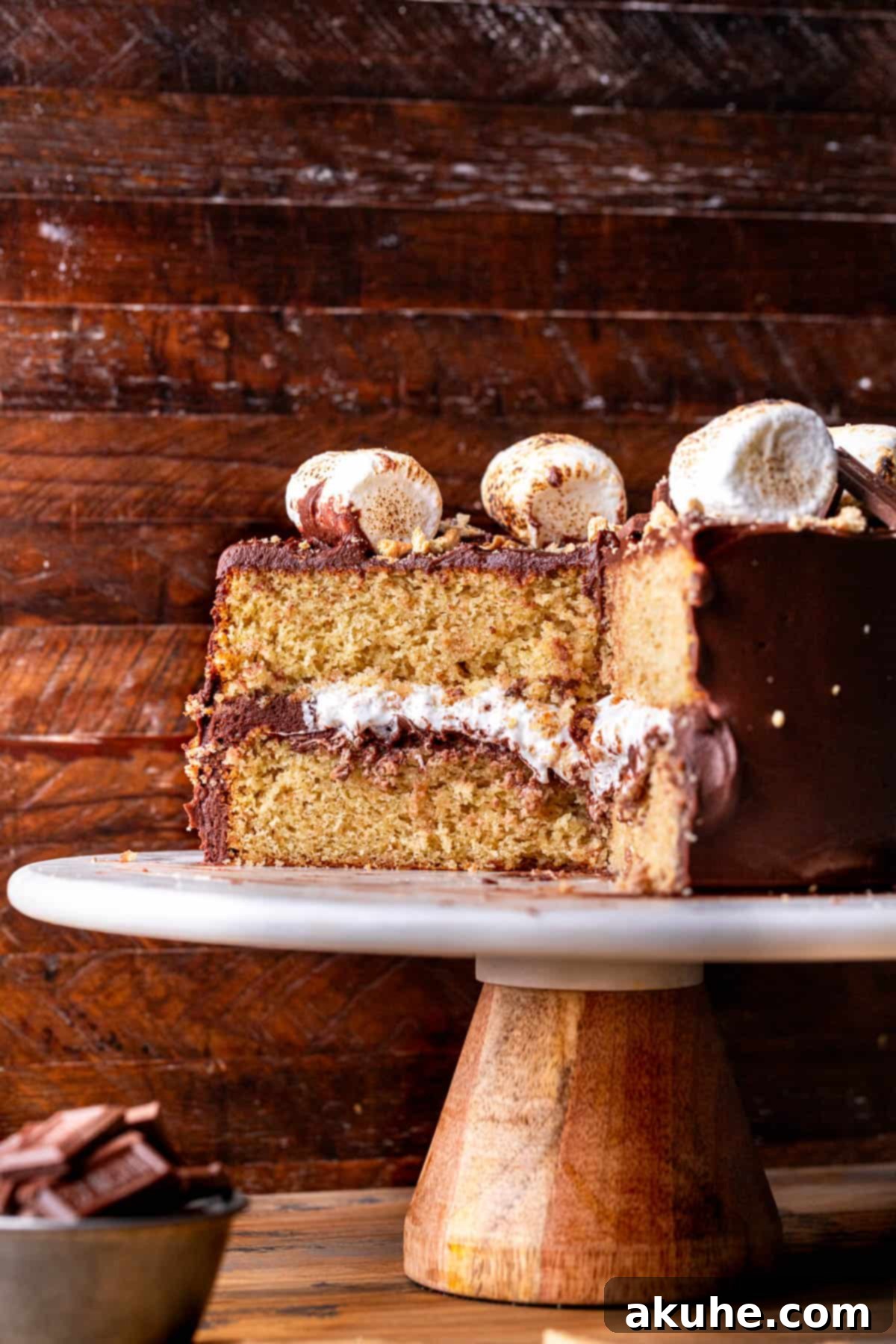 Ultimate Smores Cake 3 Decorated s'mores cake on a cake stand, ready to be served.