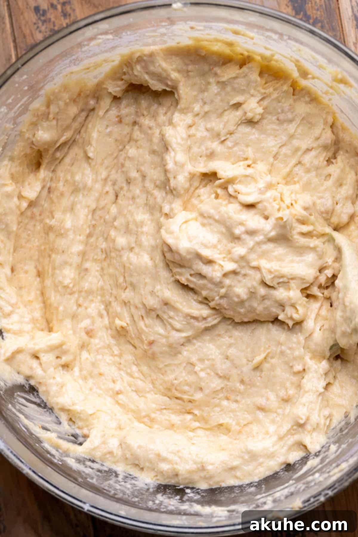 Ultimate Smores Cake 5 Graham cracker cake batter in a glass bowl, ready for pouring.