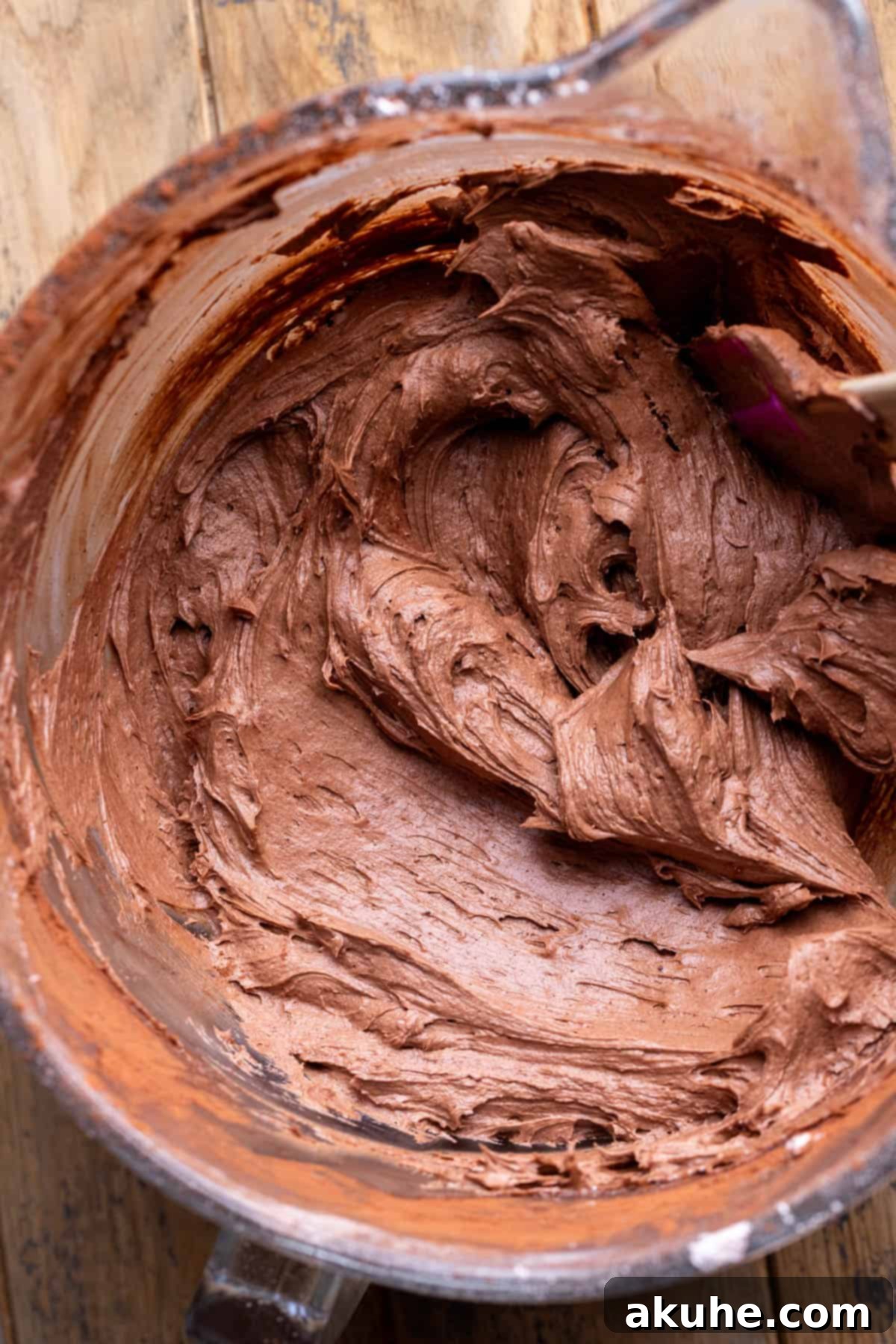 Ultimate Smores Cake 7 Rich chocolate cream cheese frosting in a glass bowl.