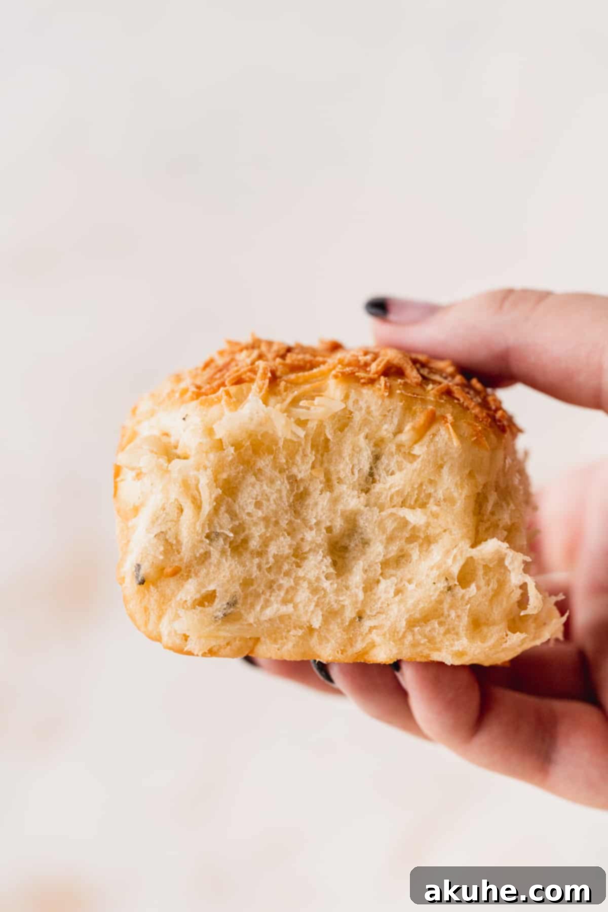 Holding up one roll.