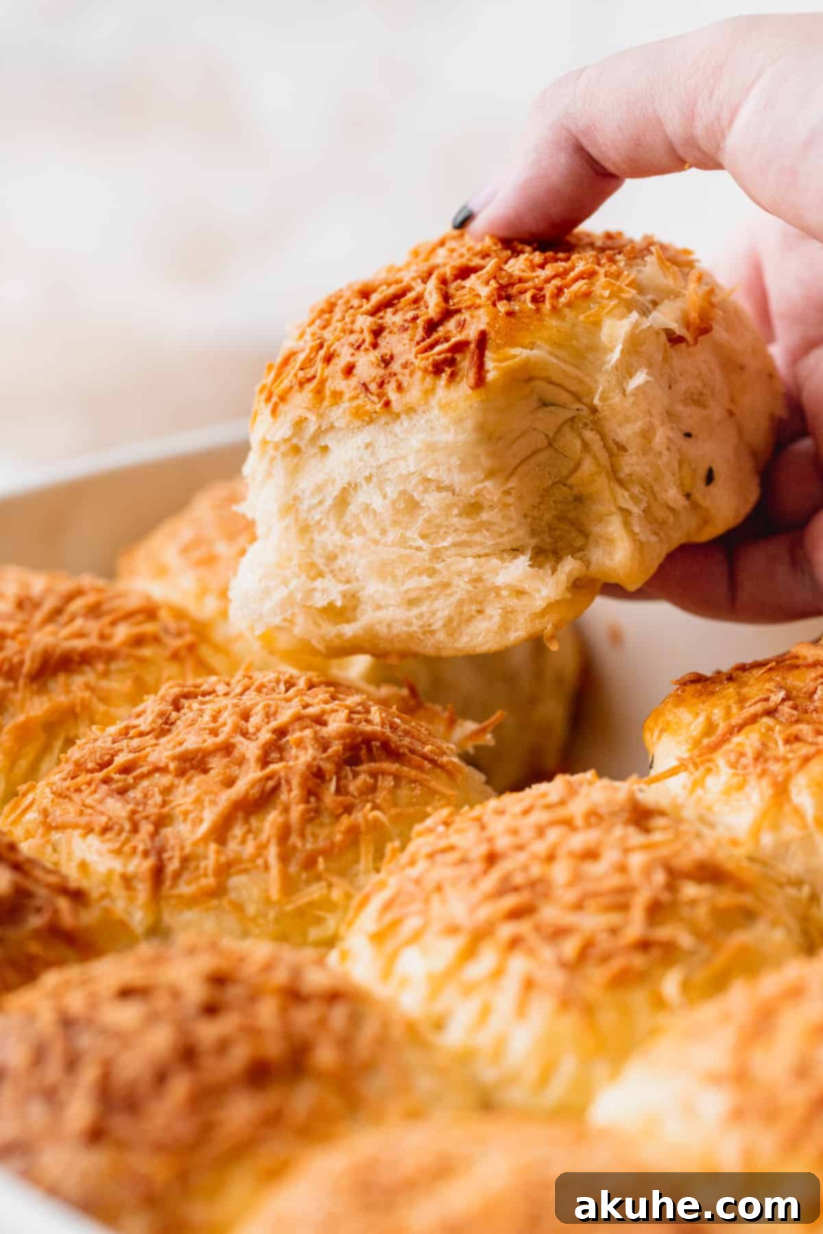 Pulling a roll out of the batch.