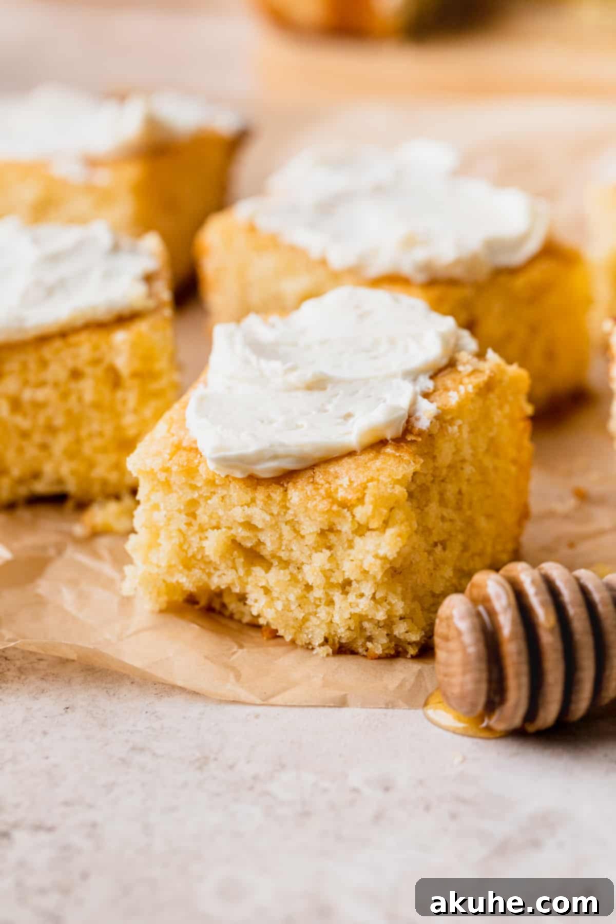 Buttery Honey Cornbread 2 Honey butter cornbread with butter on top.
