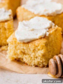 Buttery Honey Cornbread 12 Honey butter cornbread with butter on top.