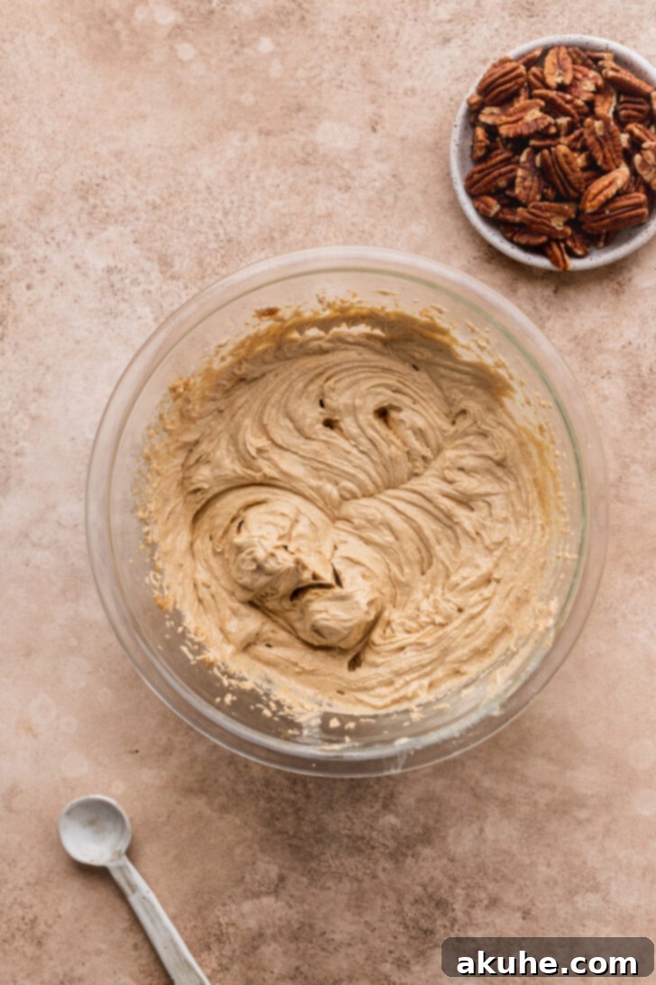 Toasted Pecan Chocolate Chip Delights 6 Cookie dough in a mixing bowl after dry ingredients have been added and lightly mixed.
