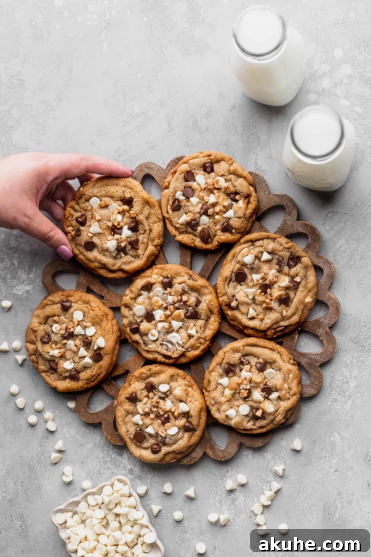 Decadent White Chocolate Toffee Cookies 4 An overhead shot of freshly baked white chocolate toffee cookies arranged neatly on a cooling rack.