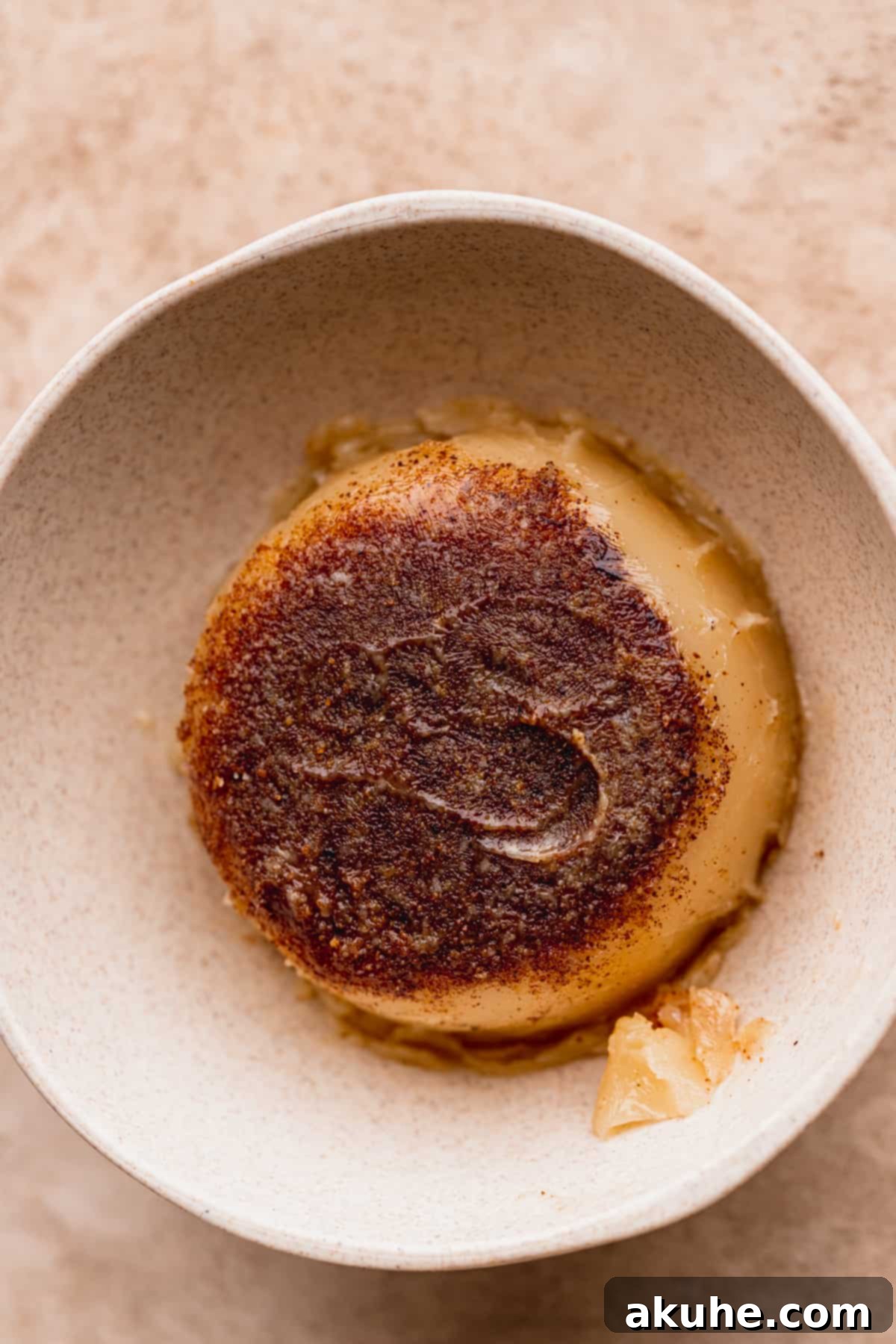 Decadent White Chocolate Toffee Cookies 5 A bowl of rich, amber-colored brown butter.