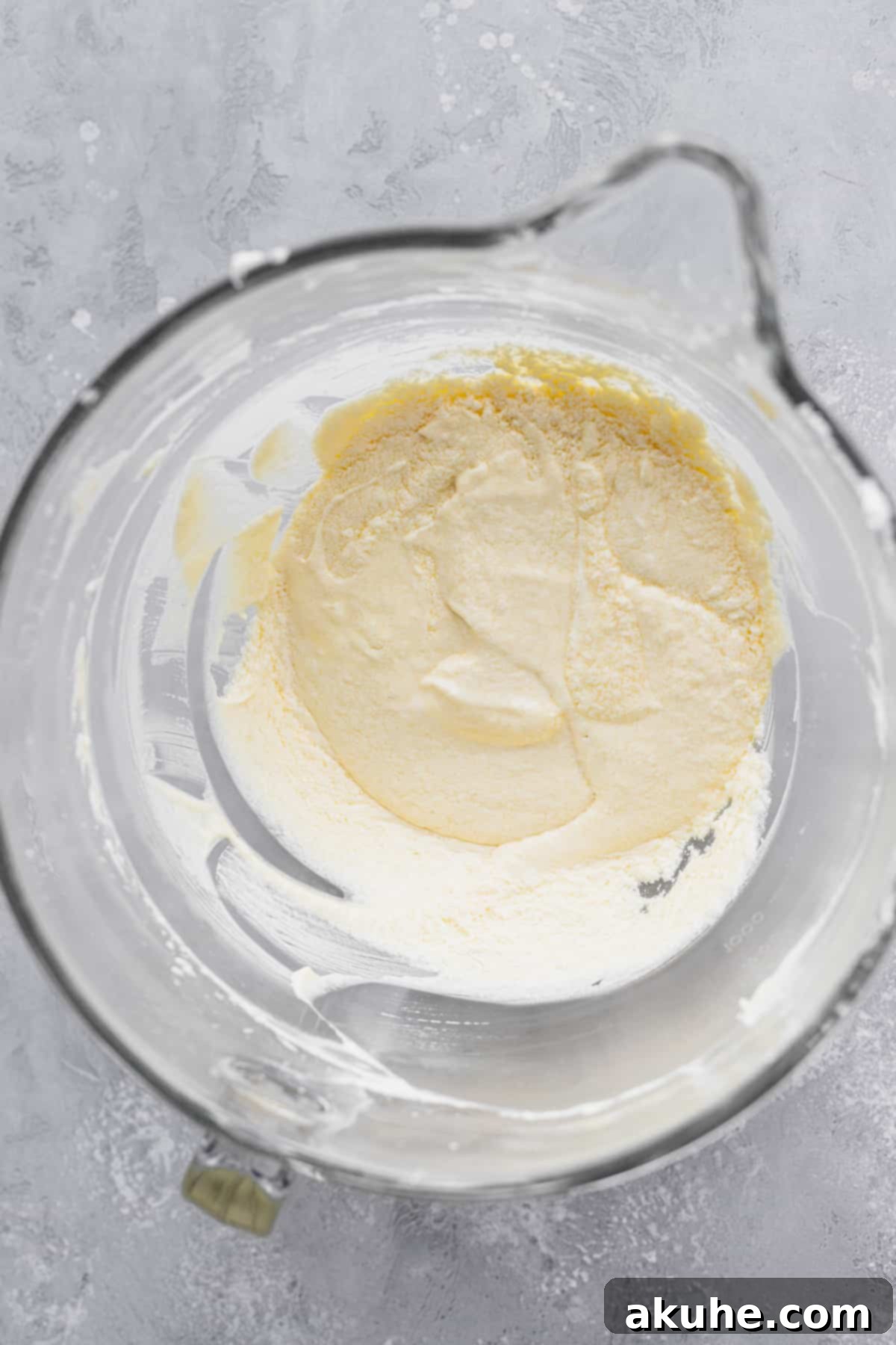 Decadent White Chocolate Cupcakes 5 The butter, sugar, vanilla, sour cream, and egg mixture in a bowl, beaten until fluffy.