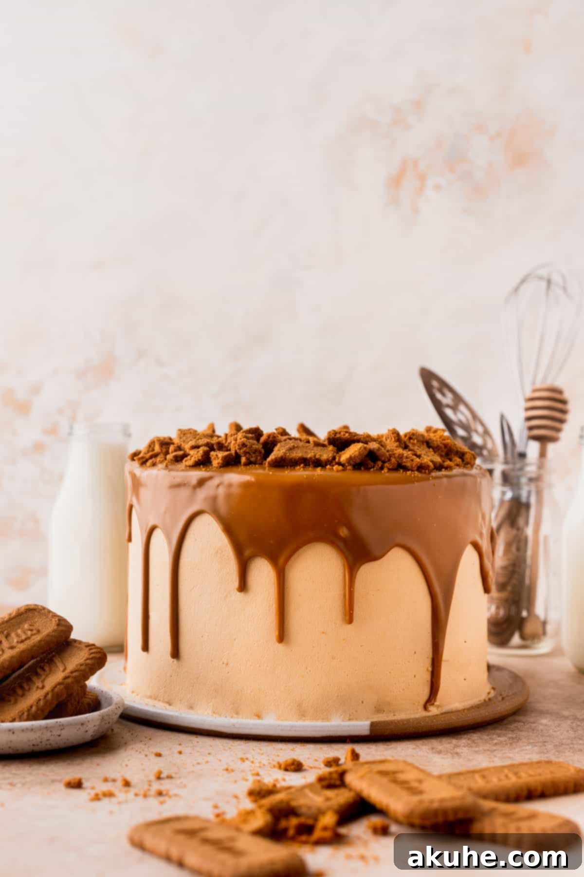 A beautifully decorated Biscoff layered cake resting on a decorative platter, ready to be served.