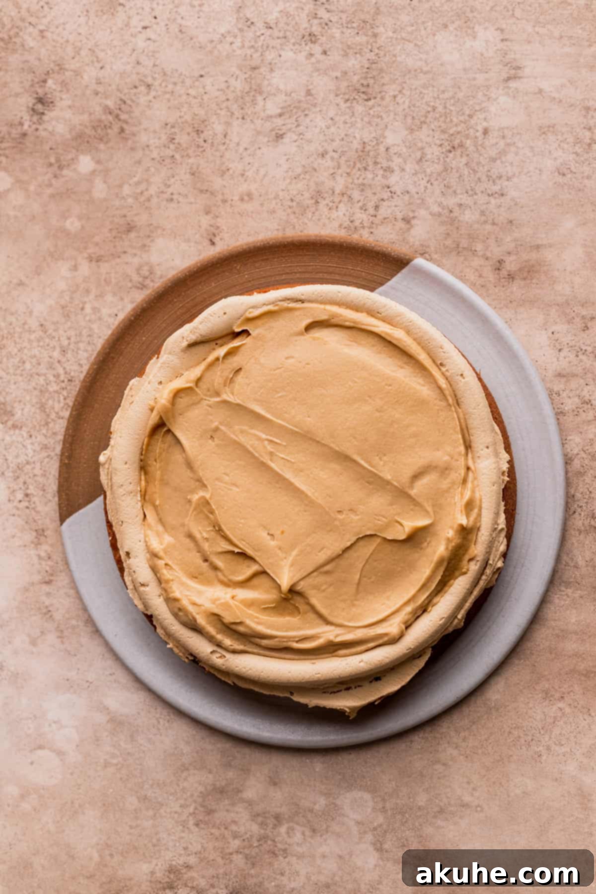 A cross-section of the Biscoff cake, showcasing the luscious cookie butter filling between layers.