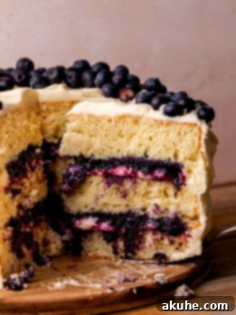 Blueberry Bliss Cake 14 Taking a slice out of the blueberry jam cake.