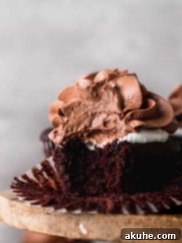 Bite missing from a hot chocolate cupcakes.
