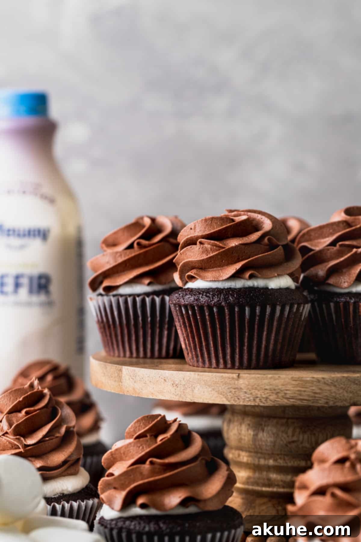 Hot chocolate cupcakes beautifully arranged on a cake stand, ready to be served.
