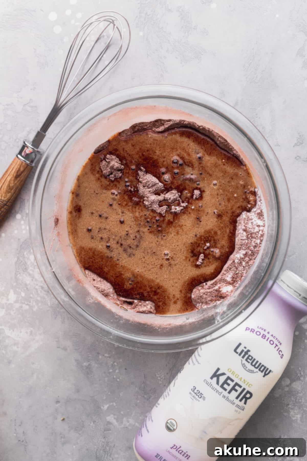 Wet ingredients being added to the dry mixture.