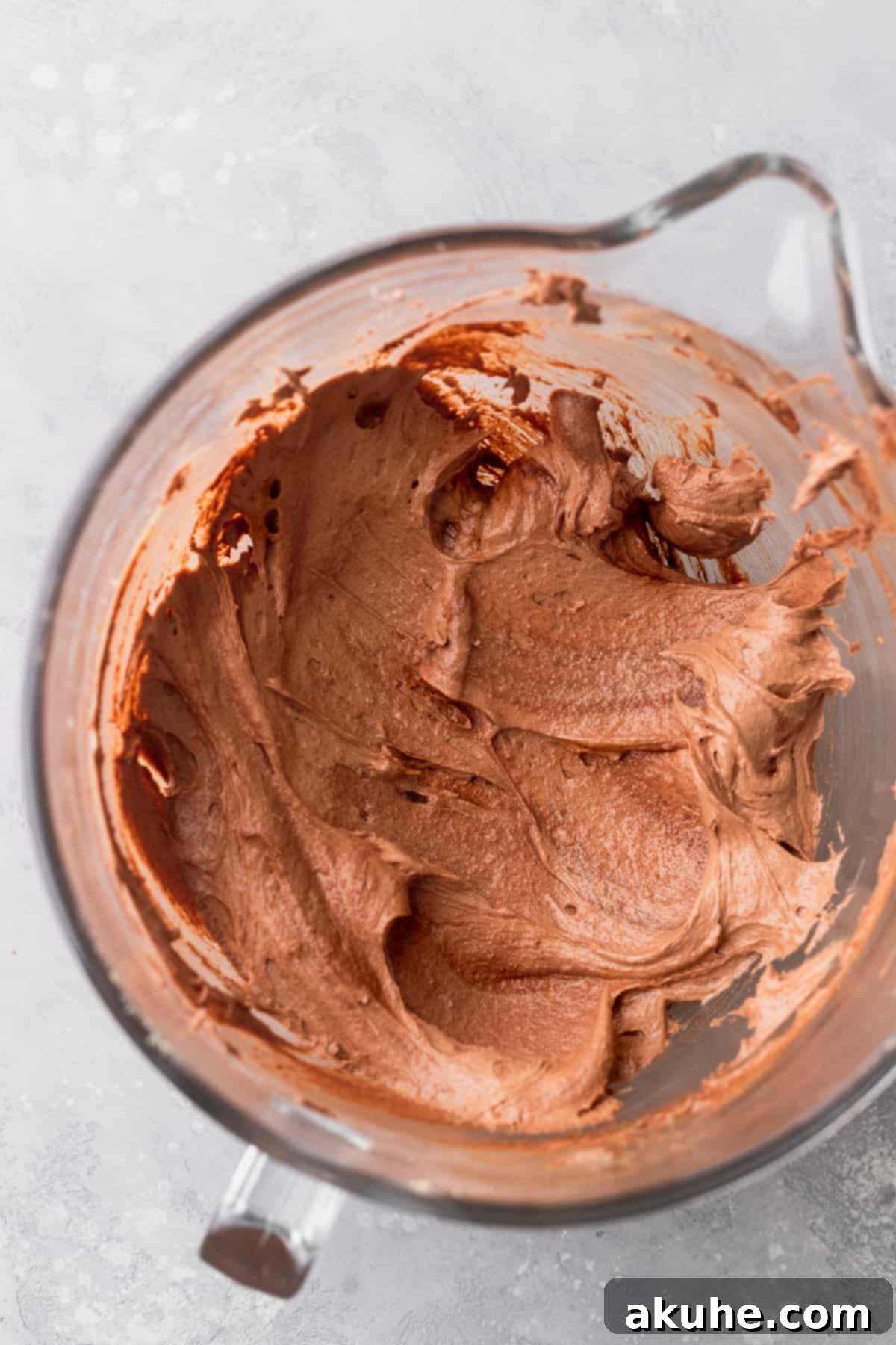 Deep Space Fudge Cookies 6 A smooth, fluffy mixture of wet ingredients including vanilla, eggs, and egg yolk, ready for dry ingredients.