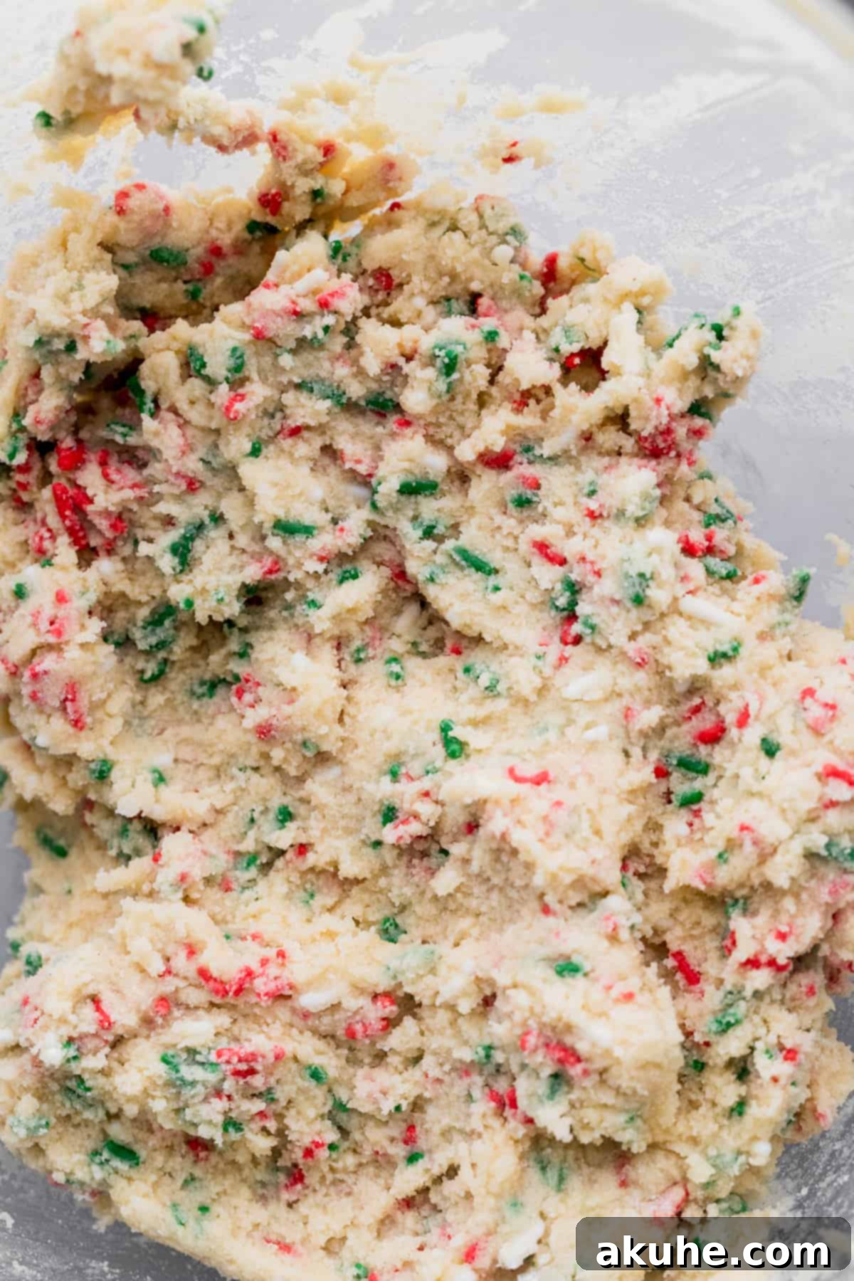 Merry & Bright Sprinkle Cookies 5 Christmas cookie dough in a glass bowl, ready for chilling.
