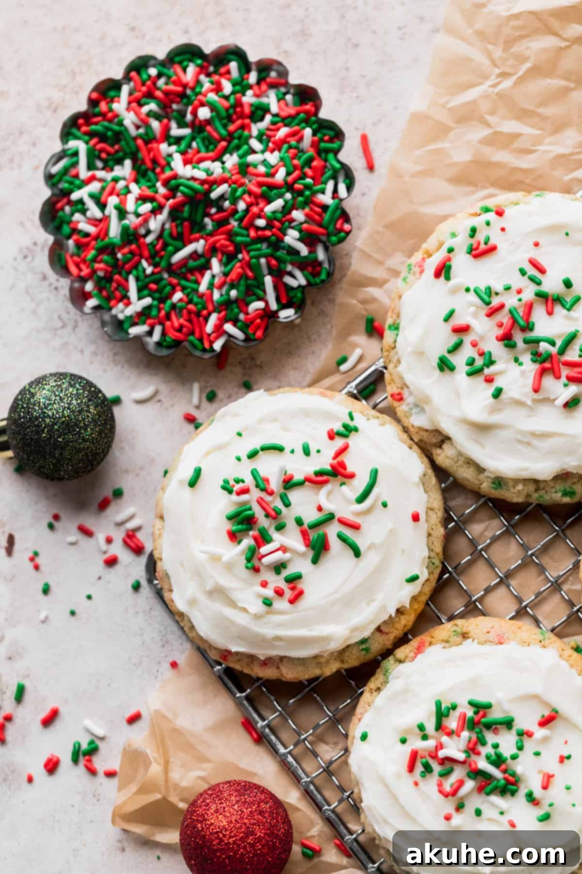 Merry & Bright Sprinkle Cookies 9 Christmas sprinkle cookies cooling on a wire rack, ready for frosting.