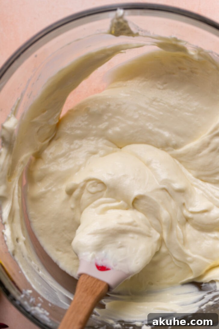 Strawberry Cheesecake Squares 5 Creamy cheesecake batter in a mixing bowl.