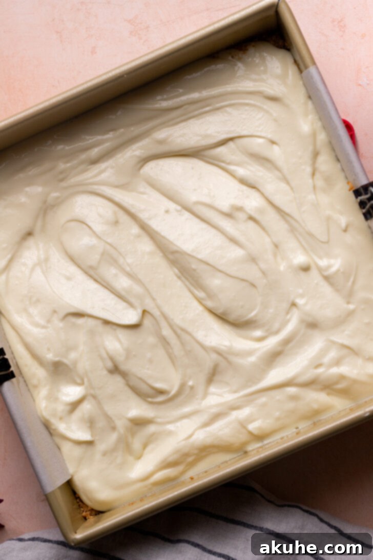 Strawberry Cheesecake Squares 6 Cheesecake batter poured into the pan, ready for baking.