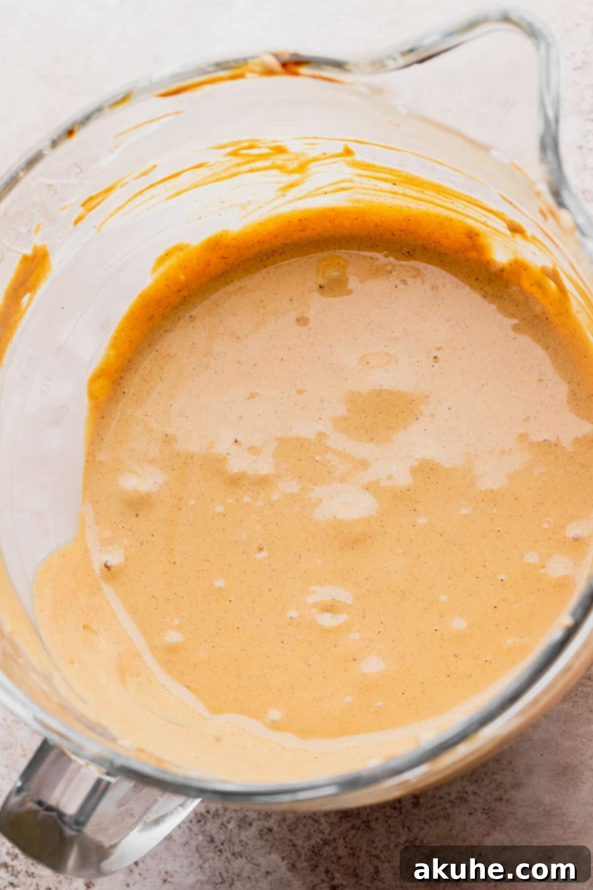 Holiday Gingerbread Cheesecake Delights 6 Cheesecake batter in a glass bowl.