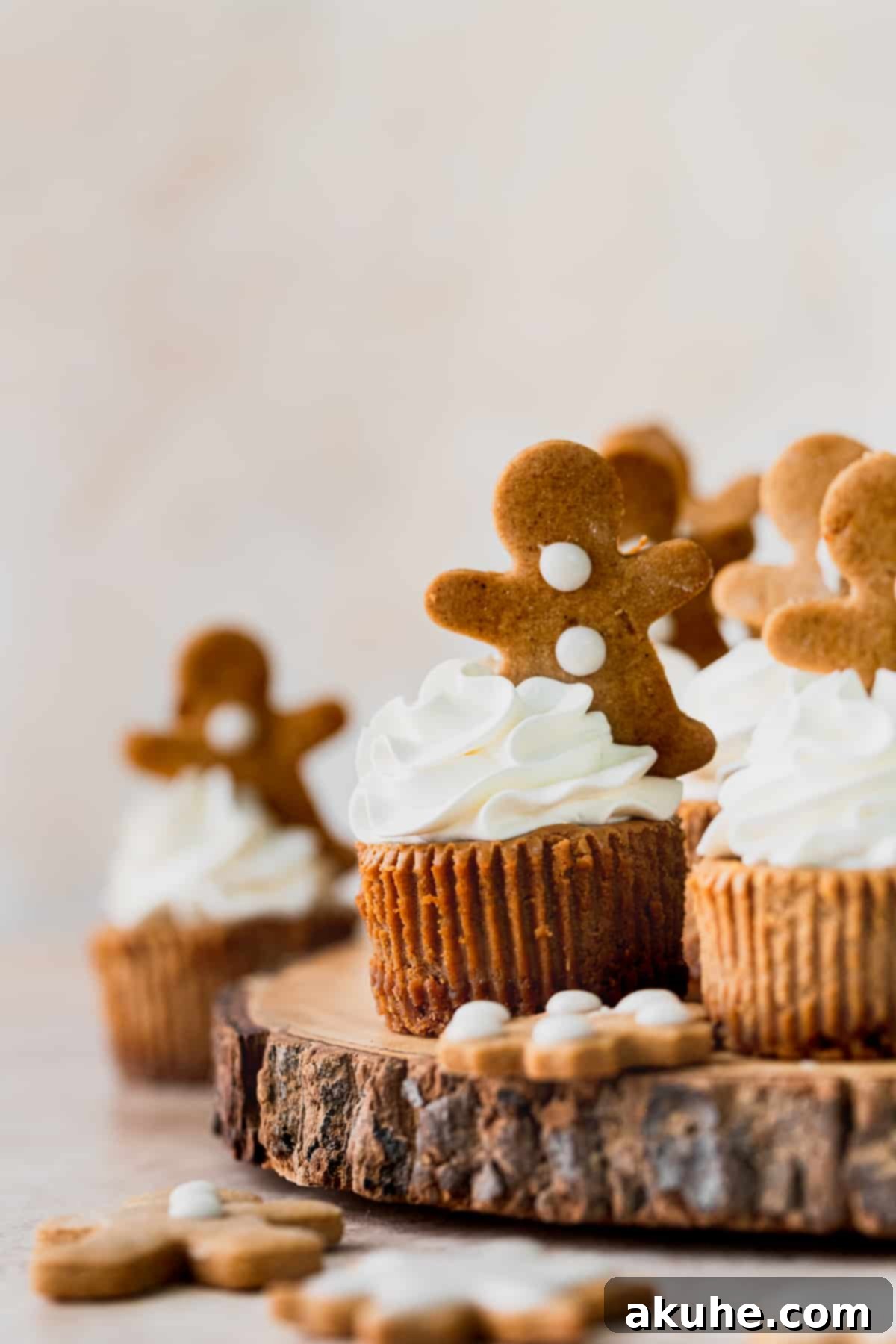 Holiday Gingerbread Cheesecake Delights 9 Mini gingerbread cheesecakes on a wooden board.