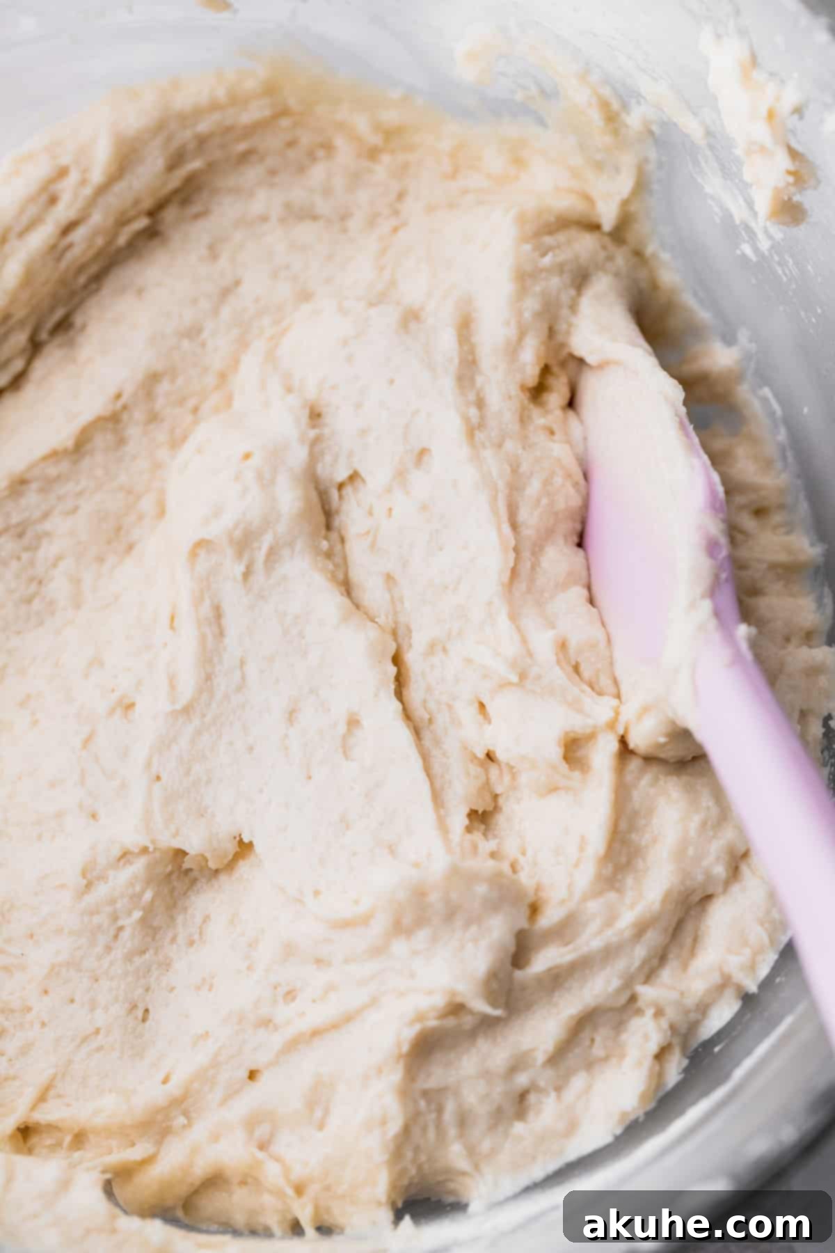 Irresistible Vanilla Nutella Cupcakes 4 Smooth, creamy vanilla cake batter in a clear glass mixing bowl, perfectly blended and ready for the next step.