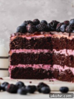 Blueberry Chocolate Layer Cake 12 A layered blueberry chocolate cake, perfectly split to reveal the moist chocolate layers and creamy blueberry frosting.