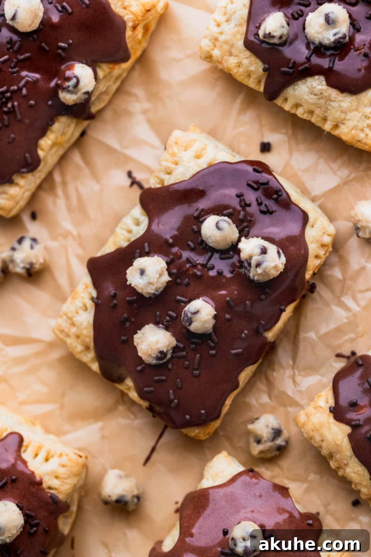 Ultimate Chocolate Cookie Dough Pop Tarts 3 Homemade chocolate cookie dough pop tarts cooling on parchment paper.