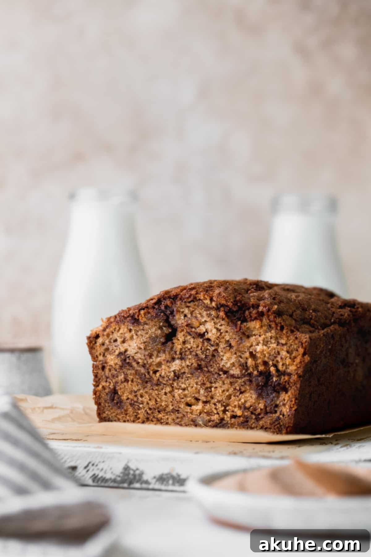 Irresistible Cinnamon Swirl Banana Bread 11 Easy cinnamon swirl banana bread on a board.