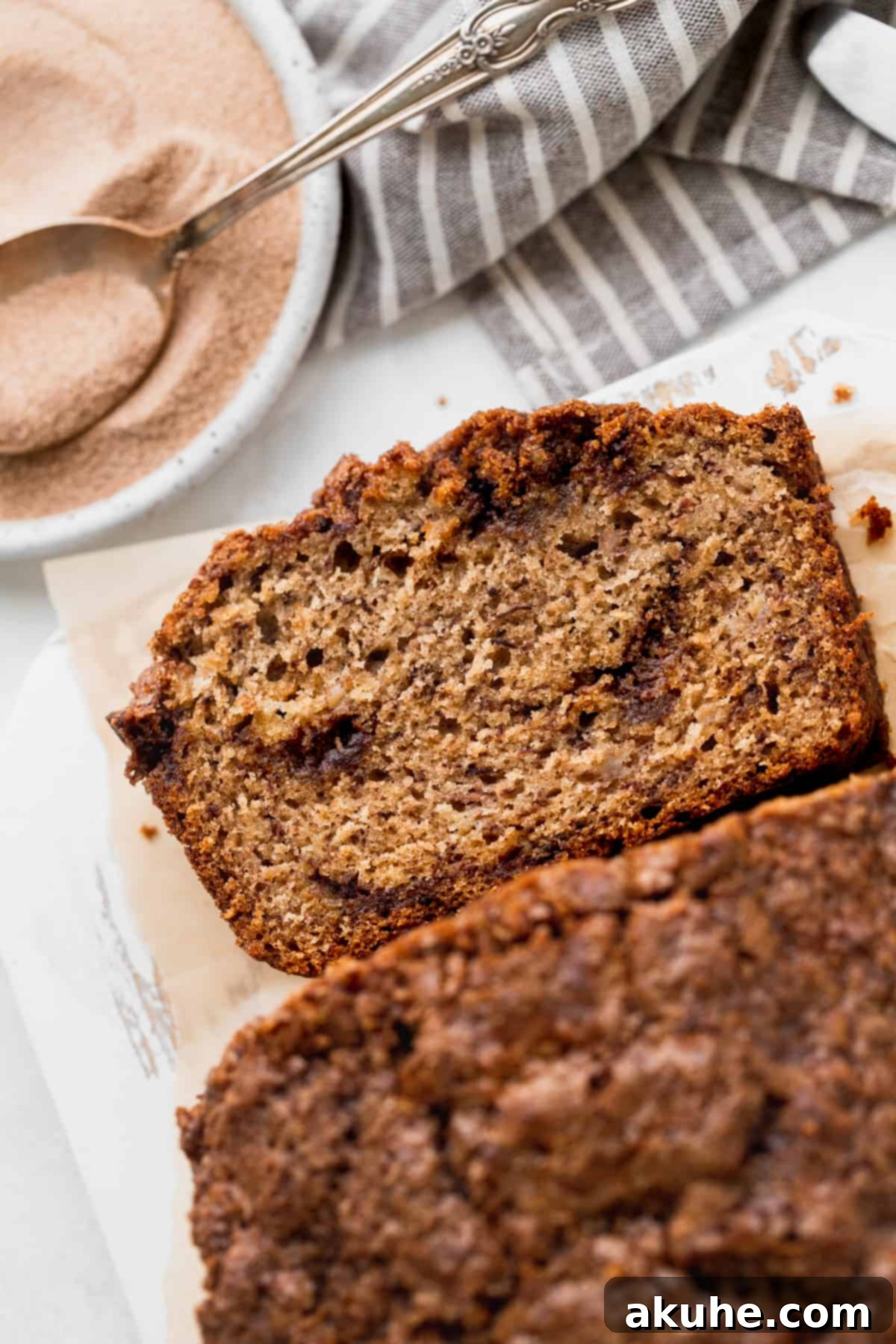 Irresistible Cinnamon Swirl Banana Bread 3 Close up of bread on the board.