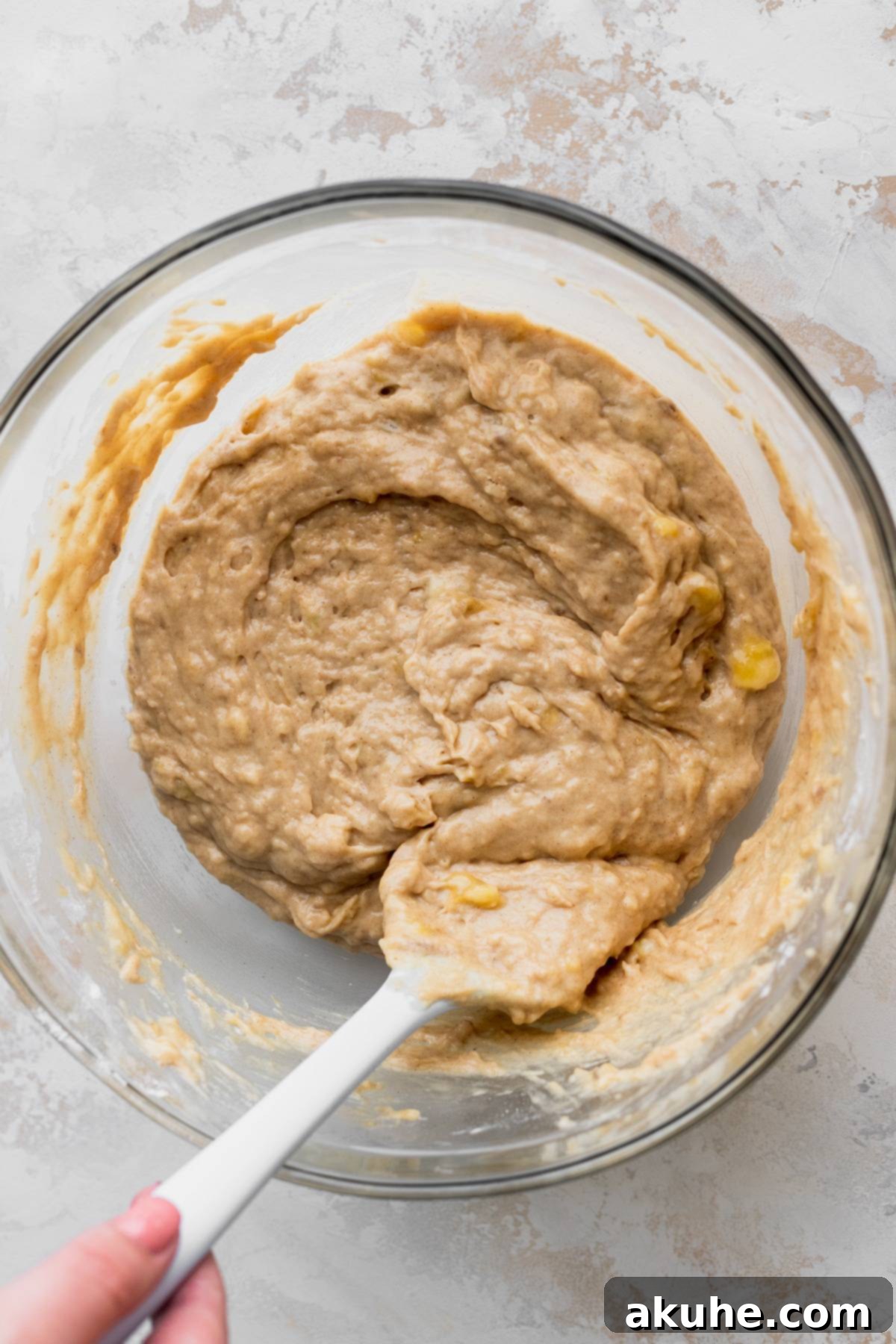 Irresistible Cinnamon Swirl Banana Bread 5 Batter in a glass bowl.