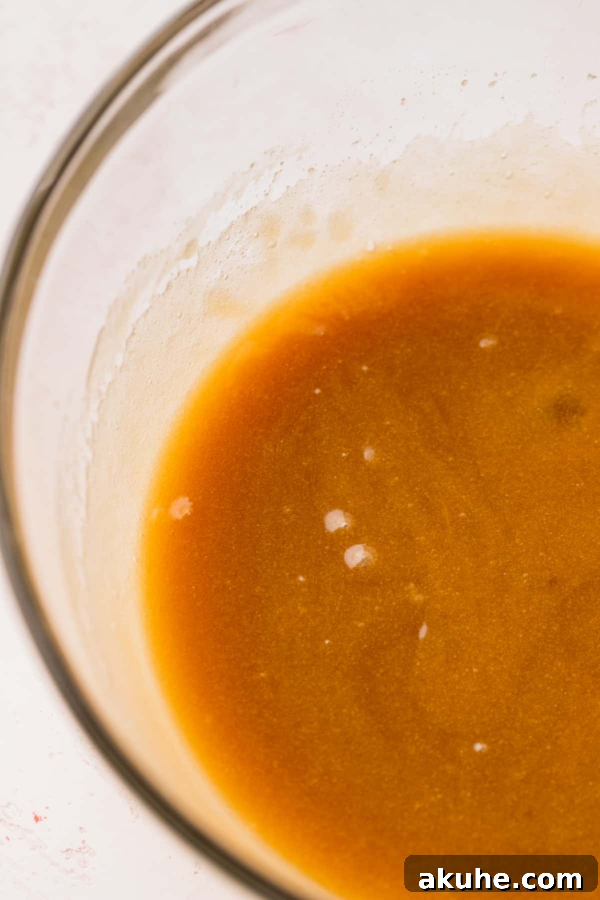 Raspberry White Chocolate Chip Cookies 4 Wet ingredients (butter, sugar, egg, vanilla) mixed in a bowl.